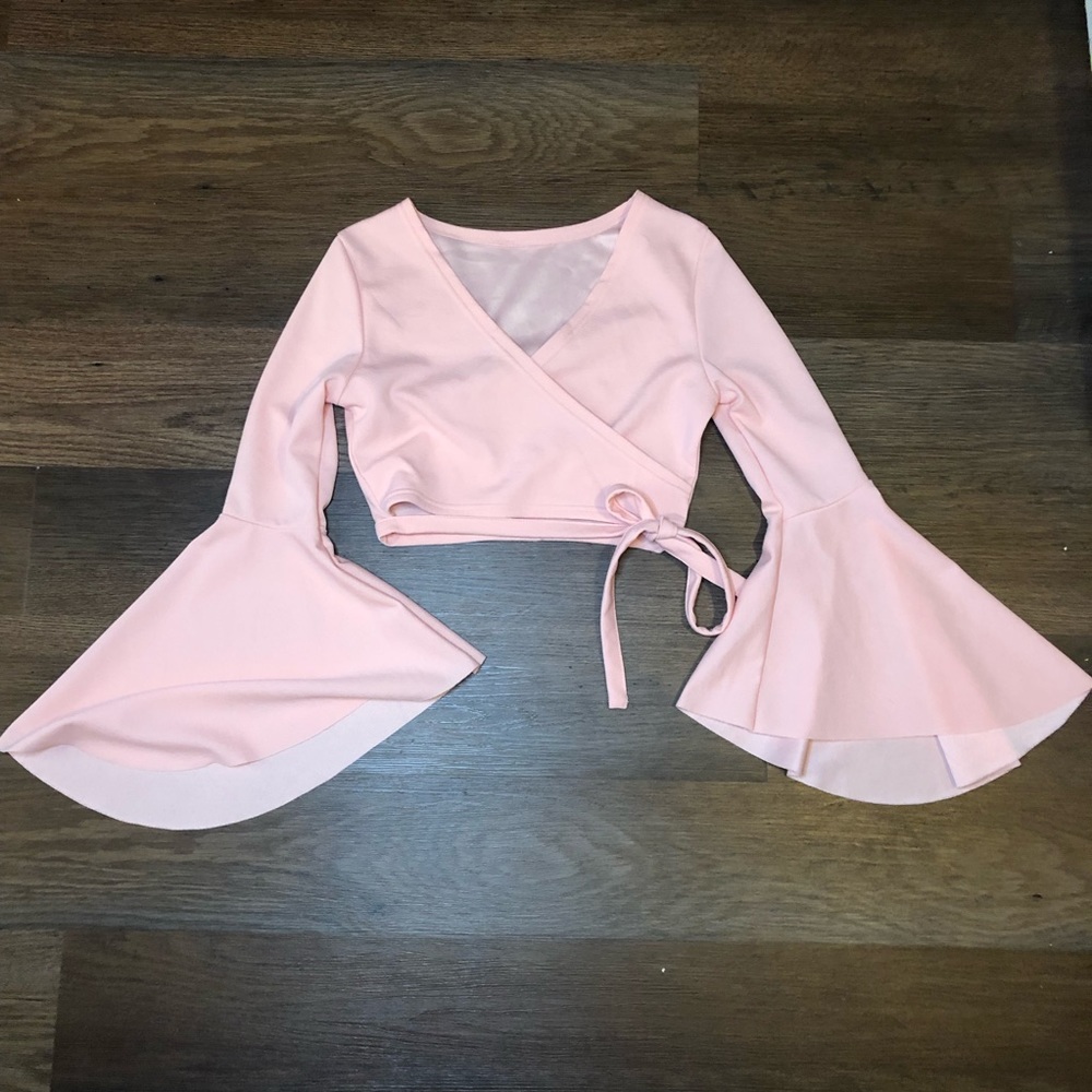 Pink tie around poofy sleeve crop top.